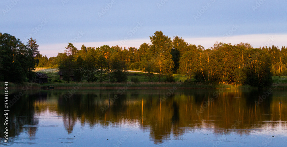 lake shore with  fog at sunset