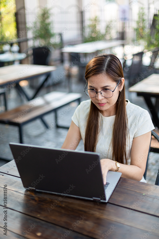 Asian woman using computer laptop work from home concept. Asian woman using computer laptop work from home concept.
