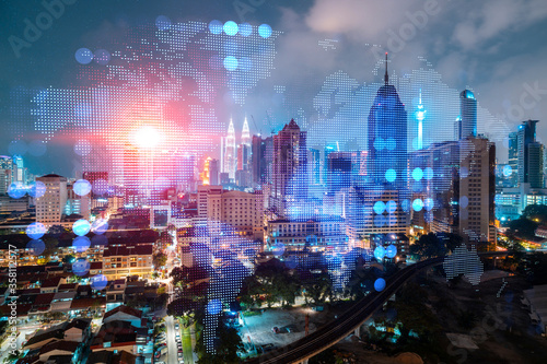 Photography Hologram of Earth planet map on night panoramic cityscape of Kuala Lumpur, Malaysia, Asia