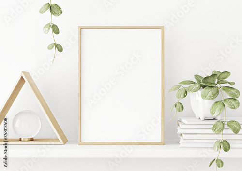 Interior poster mockup with vertical wooden frame on the shelf with green plant in pot and trendy decoration on empty white wall background. A4, A3 size format. 3D rendering, illustration.