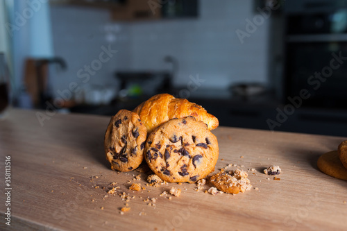 fresh sweet cookies with chocolate and croissants. breakfast with croissants. food to coffee