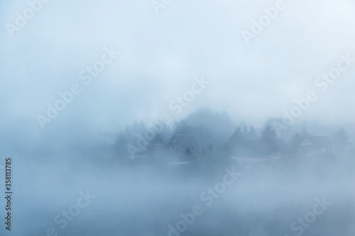 River before sunrise in the fog