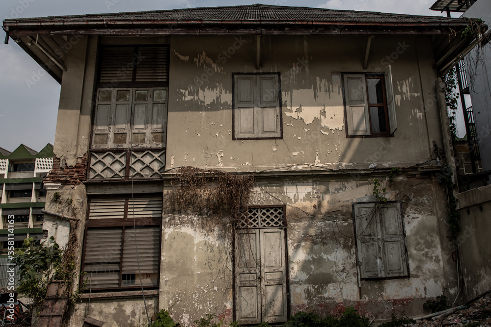 Bangkok, Thailand - Jan 19, 2020 : External of old house was left to deteriorate over time, Chinese Architecture style, Abandoned house, Destroyed house. Selective focus.