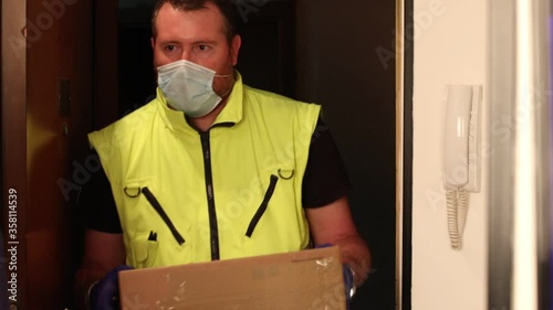 The courier delivers package at home. Delivery something in quarantine