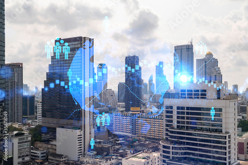 Social media icons hologram over panorama city view of Bangkok  Asia. The concept of people networking and connections. Double exposure.