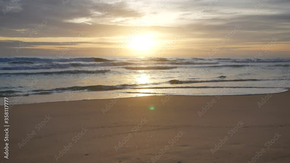 sea wave water hit sand beach , reflection in water, cloudy sky with sunset background sea wave water hit sand beach , reflection in water, cloudy sky with sunset background
