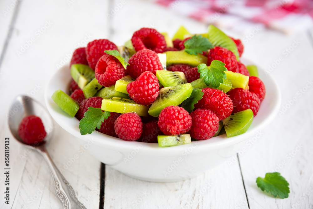 Fresh fruit salad with with raspberry and kiwi Fresh fruit salad with with raspberry and kiwi