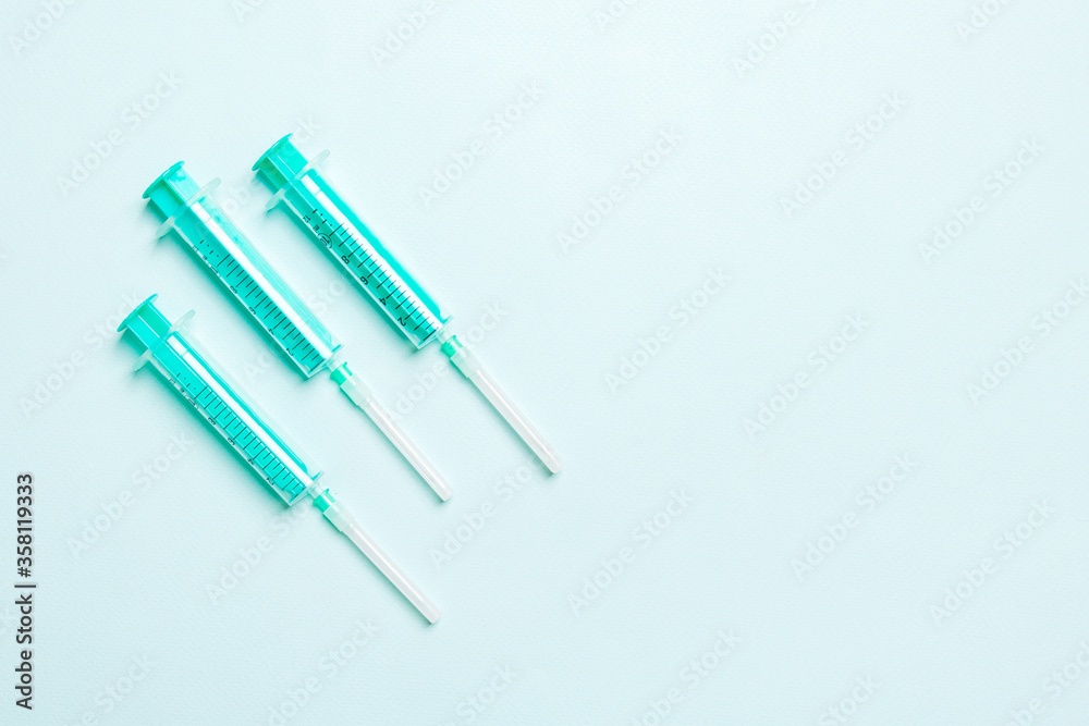 Top view of medical syringes on colorful background. Health care concept with copy space Top view of medical syringes on colorful background. Health care concept with copy space