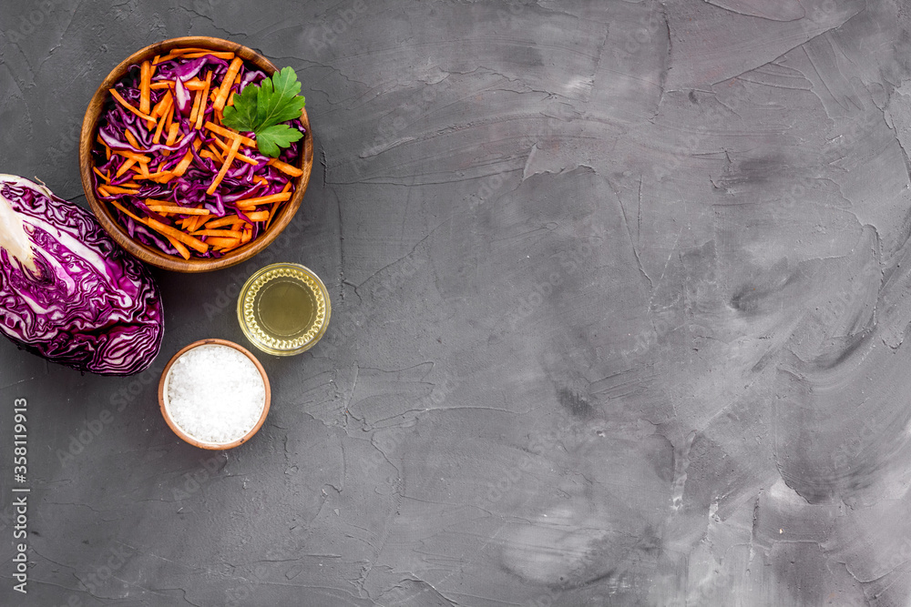 Healthy vegan salad with red cabbage on grey kitchen table top view copy space Healthy vegan salad with red cabbage on grey kitchen table top view copy space