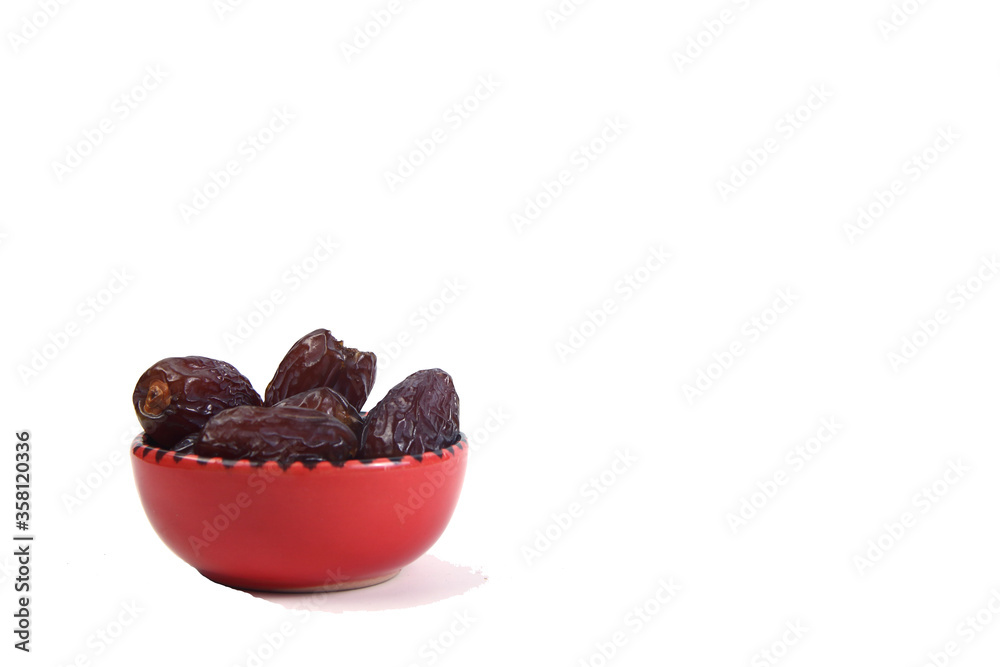 orange ceramic bowl of dates isolated on white background orange ceramic bowl of dates isolated on white background