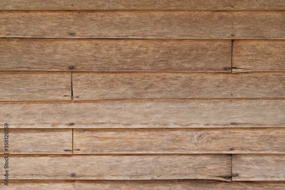 Fototapeta premium Szczegóły tekstury poziomych pasów deski drewnianej ze szwem drewnianych paneli ściennych. w tle.