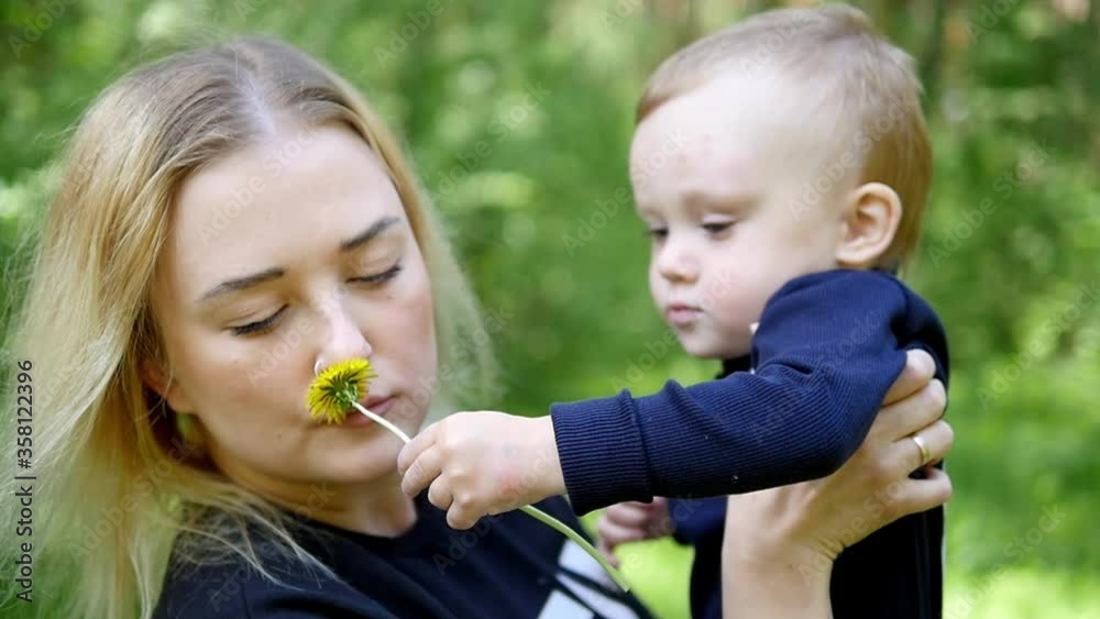 Mother and her litle boy. Happy Mother holding her sankissing and hugging. Maternity concept. Parenthood. Motherhood. Beautiful Happy Family. Mother and her litle boy. Happy Mother holding her sankissing and hugging. Maternity concept. Parenthood. Motherhood. Beautiful Happy Family.
