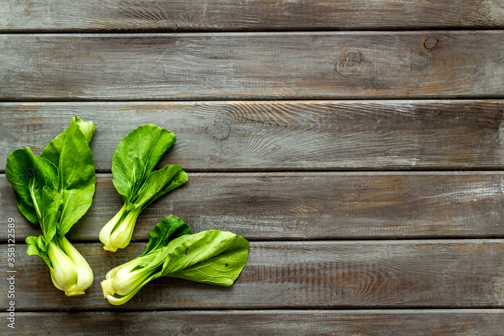 Bok choy on wooden table top view copy space Bok choy on wooden table top view copy space