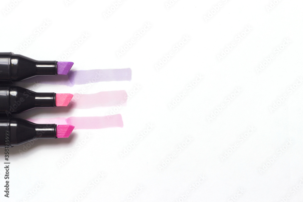 three markers with their examples isolated on white background