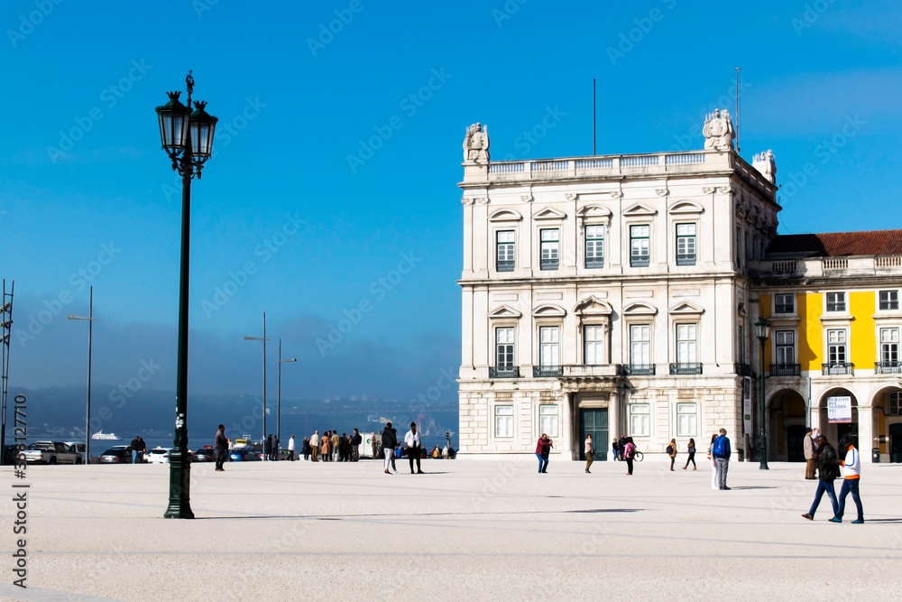 Lisbon / Portugal. Praça do comercio, with a lamp post and an old building. Tourist attraction. The most important square of the city. Historical importance.