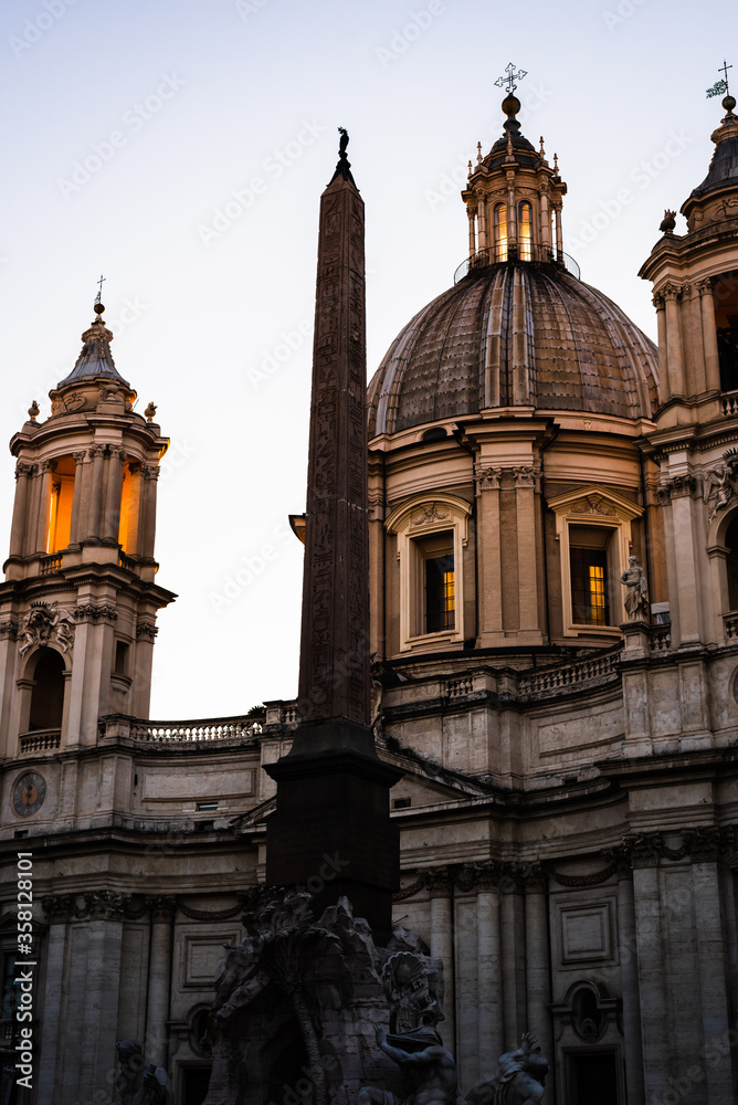 Facade of the religious building of Piazza Navona in the evening in Rome