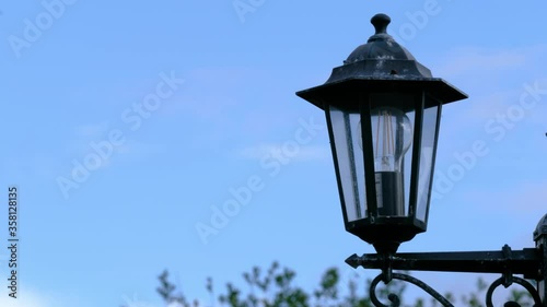 Antuque LED energy saving lamp and blue sky photo