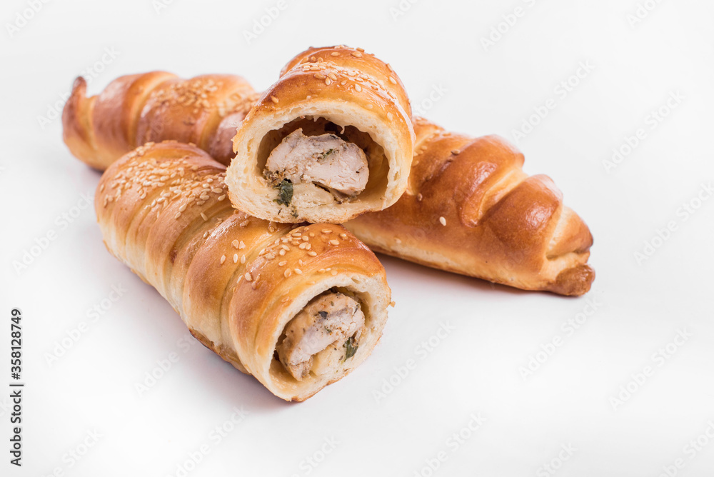 Baking a fresh bun filled with meat isolated on white background Baking a fresh bun filled with meat isolated on white background