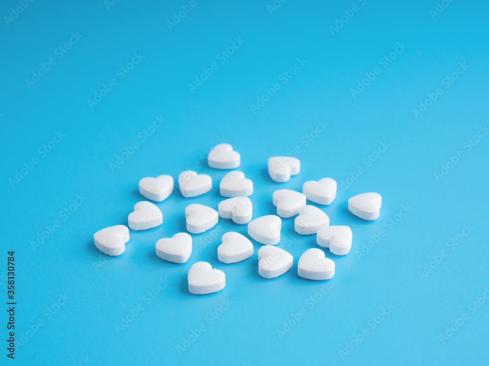 Aspirin tablets in the form of hearts. Selective focus.