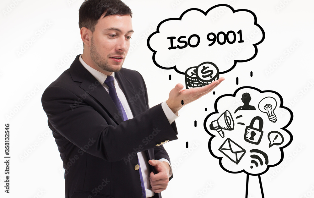Business, technology, internet and network concept. Young businessman thinks over the steps for successful growth: ISO 9001 Business, technology, internet and network concept. Young businessman thinks over the steps for successful growth: ISO 9001