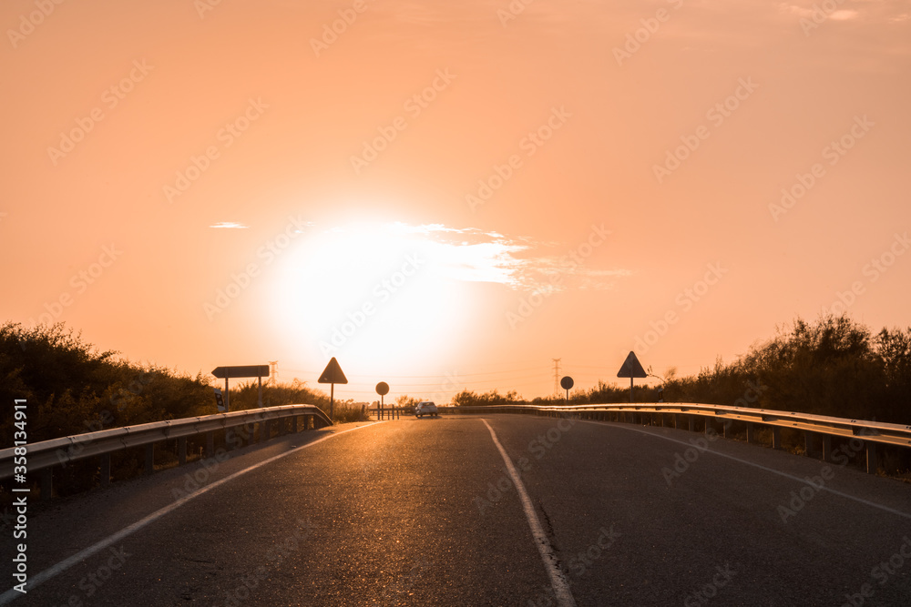 Highway road to Gerena at sunset.