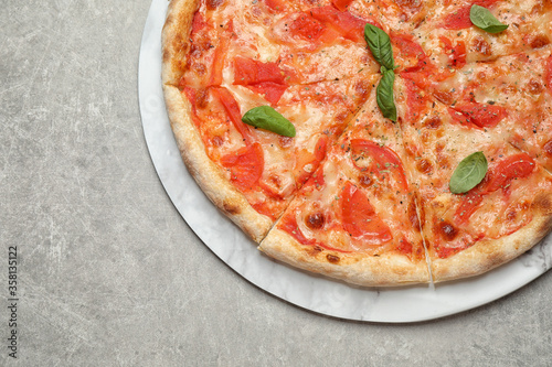 Delicious pizza Margherita on light grey table, top view