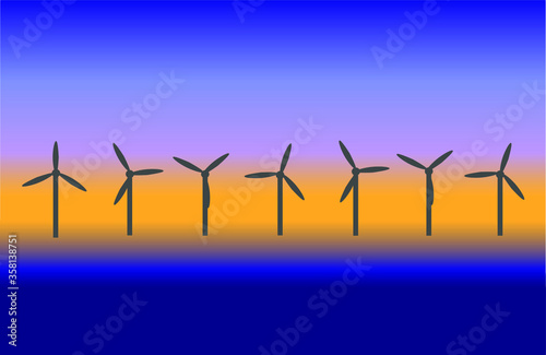 Offshore wind turbines at sunrise.