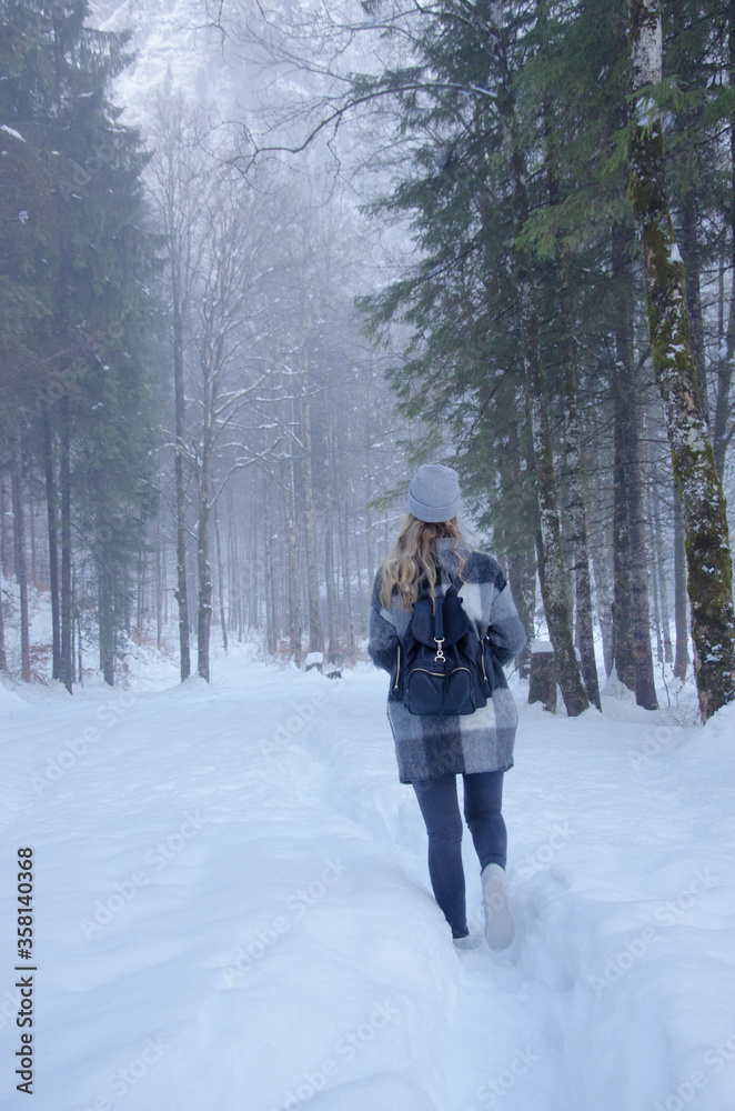 Girl walking in the snow