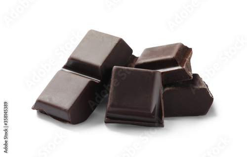 Pieces of delicious dark chocolate isolated on white
