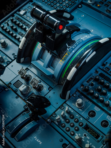 Fototapeta Naklejka Na Ścianę i Meble -  Closeup high detailed view power control and other aircraft control unit in the cockpit of modern civil passenger airplane