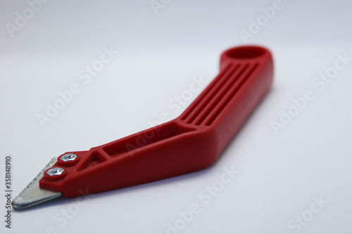 Grout remover or scraper with saw blades to remove grout from the floor or wall