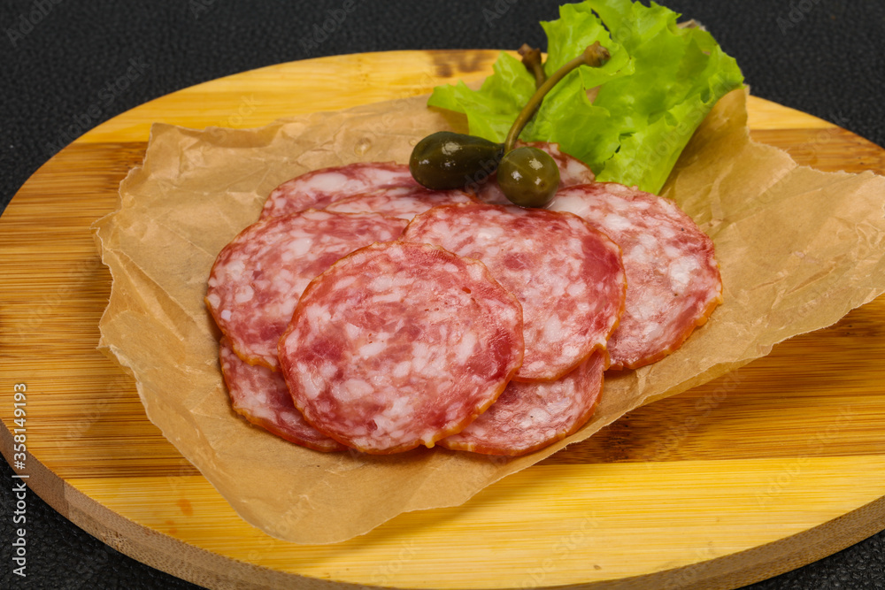 Spanish Salchichon sausage with salad Spanish Salchichon sausage with salad