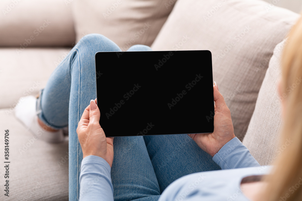 Job search concept. Adult woman surfing in internet with blank screen tablet Job search concept. Adult woman surfing in internet with blank screen tablet