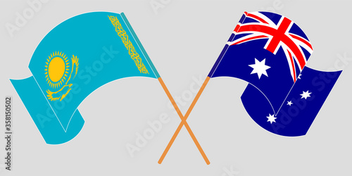 Crossed and waving flags of Kazakhstan and Australia