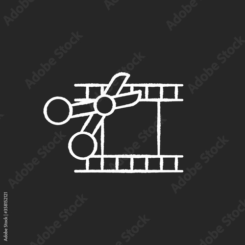 Film edit chalk white icon on black background. Movie montage. Cut film strip with scissors. Camera negative slides. Movie maker. Television editor. Isolated vector chalkboard illustration