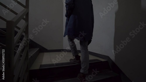 Lonely man on an post apocalyptic world walking on a staircase