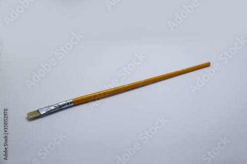 Brush refers to a tool consisting of bristles or threads attached to the end of a cable, a tool used to paint and clean