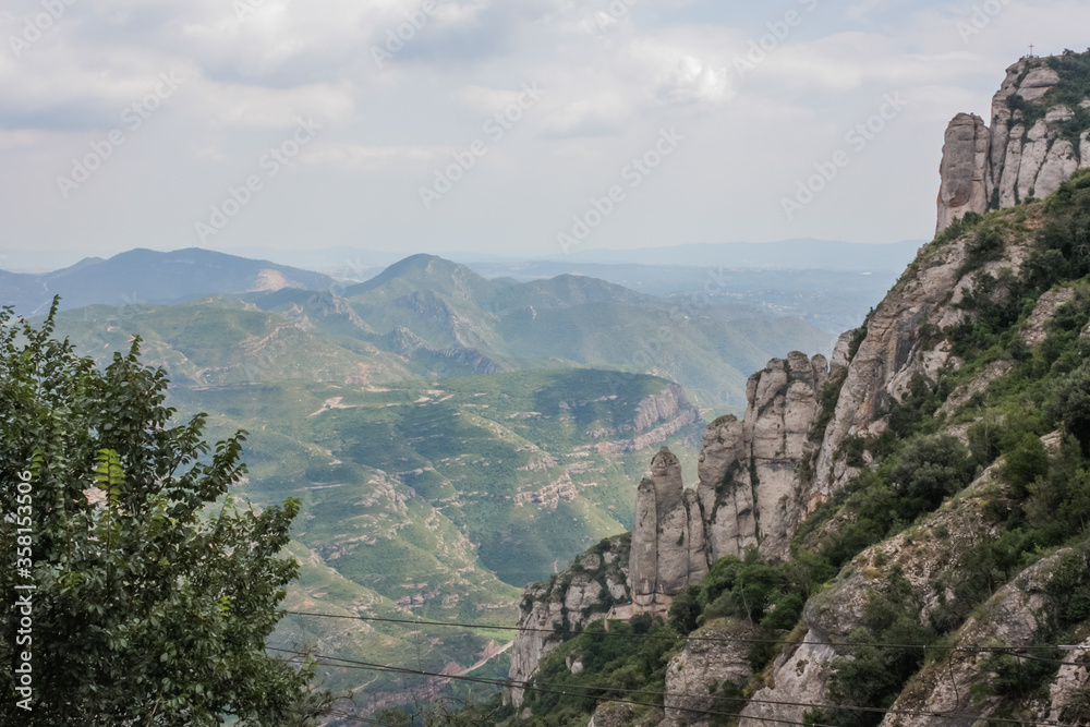 Spain. Catalonia - 30 AUGUST 2014. View from the top of the Montserrat Mountains and the Montserrat Monastery in the lower part
