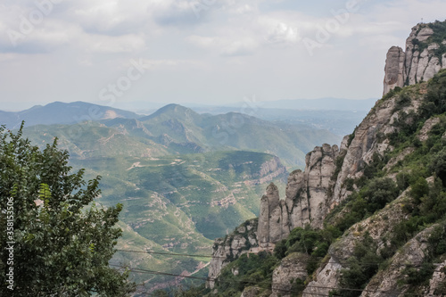 Spain. Catalonia - 30 AUGUST 2014. View from the top of the Montserrat Mountains and the Montserrat Monastery in the lower part © decorator