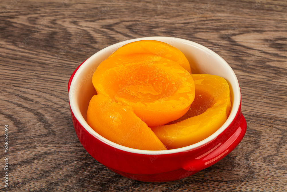 Marinated peaches fruit in the bowl