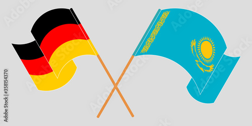 Crossed and waving flags of Kazakhstan and Germany