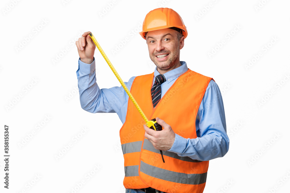 Builder Workman Posing With Tape-Measure Smiling To Camera, White Background Builder Workman Posing With Tape-Measure Smiling To Camera, White Background