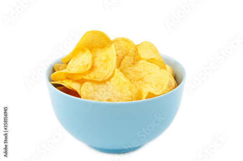 Potato chips in blue bowl isolated on white background