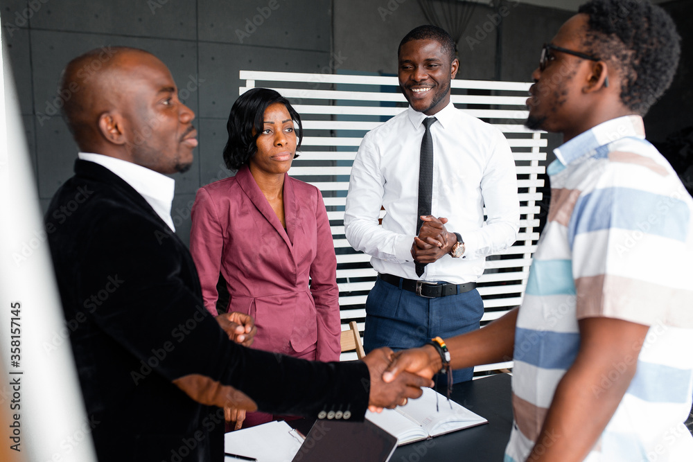 Management the company employs the firm a new black employee. Hall of negotiations of a large company. Management the company employs the firm a new black employee. Hall of negotiations of a large company.