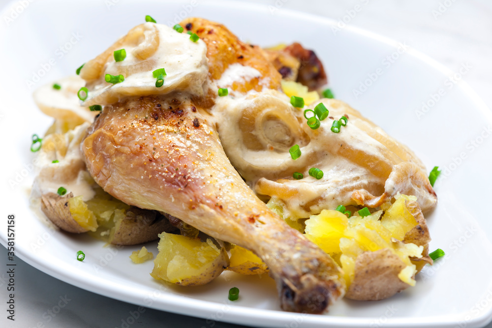 chicken leg on creamy onion sauce with potatoes chicken leg on creamy onion sauce with potatoes