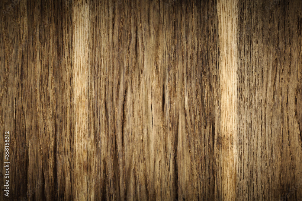 original dark brown background from an old veneered furniture panel with signs of aging and wear, with an expanded embossed surface original dark brown background from an old veneered furniture panel with signs of aging and wear, with an expanded embossed surface