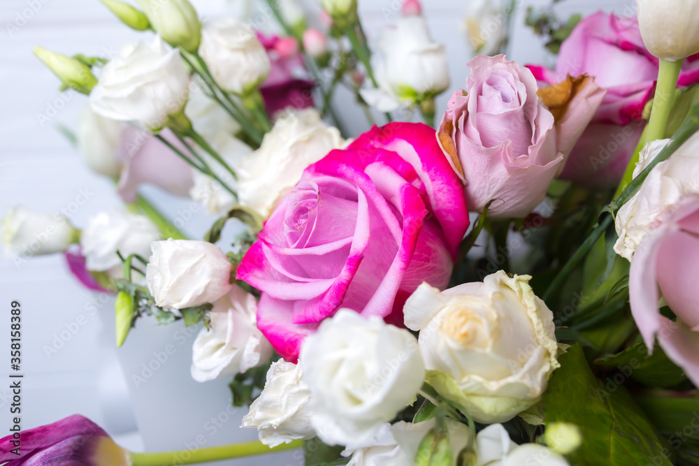 Beautiful bouquet of flowers on white background. Roses, eustoma and tulips. Stylish present for all holidays. Happy birthday gift. Mother's day postcard. Spring mood.