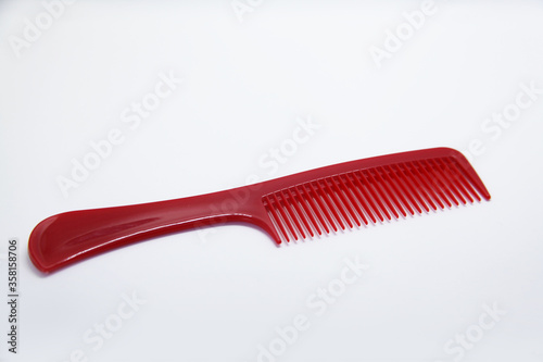 Plastic comb suitable for short and long haircuts  designed not to scratch the scalp or damage hair