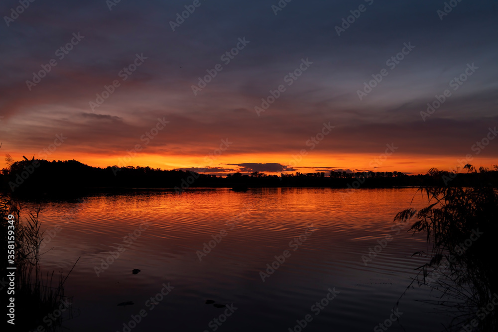 Sunset over the pond Rezabinec near Pisek town, Southern Bohemia, Czech Republic