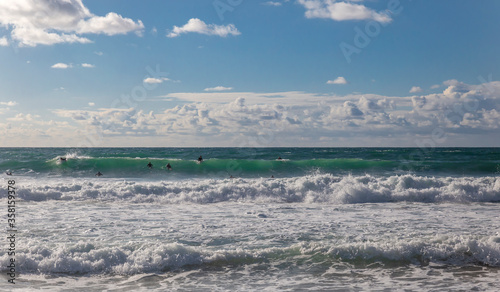 Surfing people in the sea waves